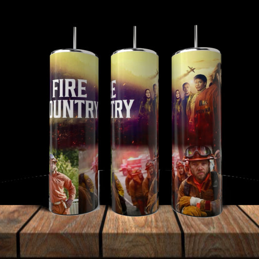 Three Fire Country 20oz Skinny Tumblers by Kreative Kreationz with straws, eco-friendly stainless steel, bold firefighter and flame graphics, and "FIRE COUNTRY" text displayed on wood against a black backdrop.