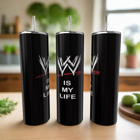 Three Kreative Kreationz WWF Is My Life 20oz black stainless steel tumblers with silver lids and straws sit on a kitchen counter. Each eco-friendly tumbler displays the WWF logo and "IS MY LIFE." Blurred kitchen items appear in the background.