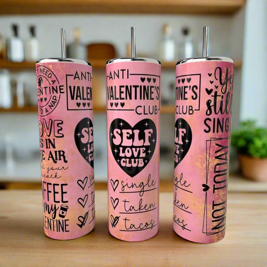 Three pink Kreative Kreationz Anti Valentines Day 20oz Tumblers with heart graphics feature phrases like "Anti-Valentine's Club," "Self Love Club," "single, taken, tacos," and "You still single?" displayed on a kitchen counter.