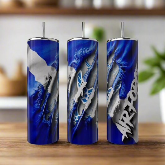 Three "Military Series 20oz Stainless Steel Tumblers" by Kreative Kreationz, featuring a claw mark design and "AIR FORCE" text, sit on a wooden counter. The blurred background hints at a cozy kitchen setting, enhancing their robust charm.