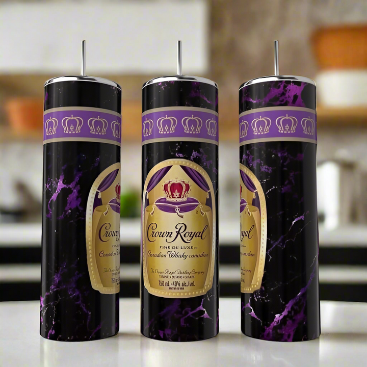 Kreative Kreationz’s Crown 20oz Tumblers feature a Crown Royal whiskey label and purple marble design, complete with straws—eco-friendly drinkware displayed on a kitchen counter, ideal for any occasion.