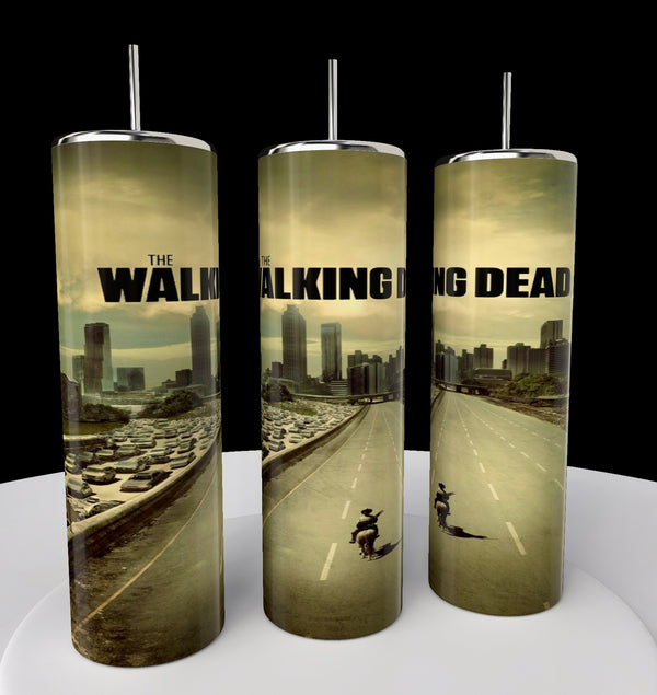 Kreative Kreationz's The Walking Dead 20oz Skinny Tumblers feature an eco-friendly design of an apocalyptic cityscape with a lone figure on horseback navigating a traffic-jammed highway under cloudy skies.