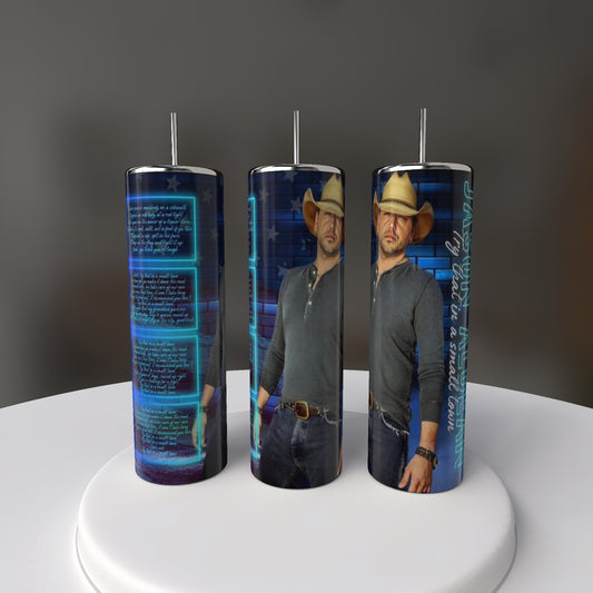 Set against a dark background, the Jason Aldean 20oz Tumblers by Kreative Kreationz display a man in a cowboy hat, gray shirt, and jeans with blue digital text and graphics. These eco-friendly stainless steel tumblers feature an exclusive design.