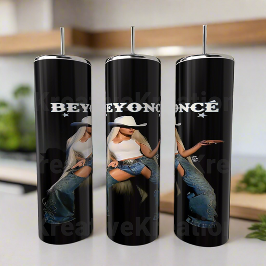 The Beyonce 20oz Stainless Steel Tumblers by Kreative Kreationz feature Beyoncé in a white hat, top, and jeans with “BEYONCÉ” above her. These eco-friendly tumblers come with silver straws and add style to any kitchen counter.
