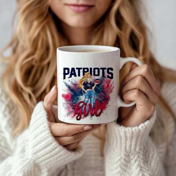 A woman in a white sweater holds the Kreative Kreationz Patriots Girl Ceramic Mug (11oz), featuring "PATRIOTS Girl" and a blonde woman in team colors amid red and blue splashes. This eco-friendly mug is perfect for fans.
