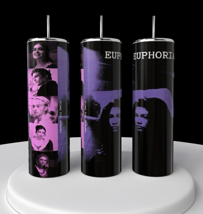 Three sleek Kreative Kreationz Euphoria 20oz Tumblers, made from stainless steel, display a black and purple design with "EUPHORIA" in bold white letters. The left tumbler features a collage of black-and-white portraits on a purple strip. These eco-friendly tumblers rest on a circular white platform.