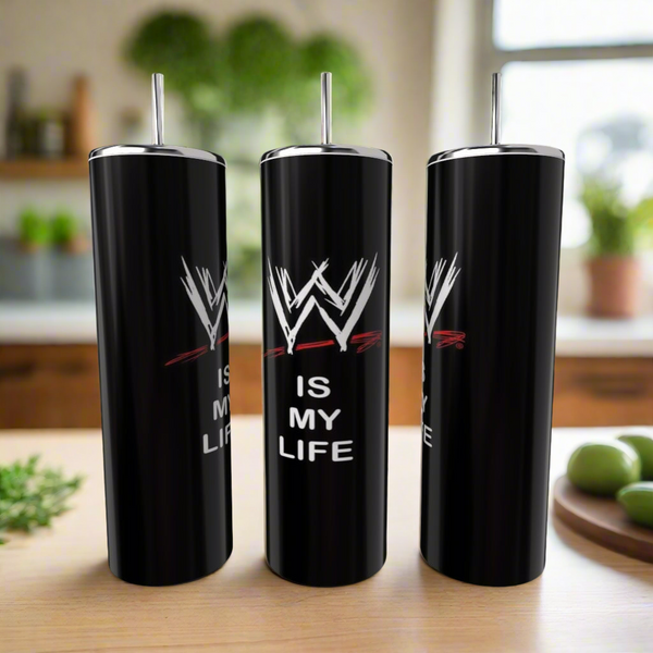 Three Kreative Kreationz WWF Is My Life 20oz black stainless steel tumblers with silver lids and straws sit on a kitchen counter. Each eco-friendly tumbler displays the WWF logo and "IS MY LIFE." Blurred kitchen items appear in the background.