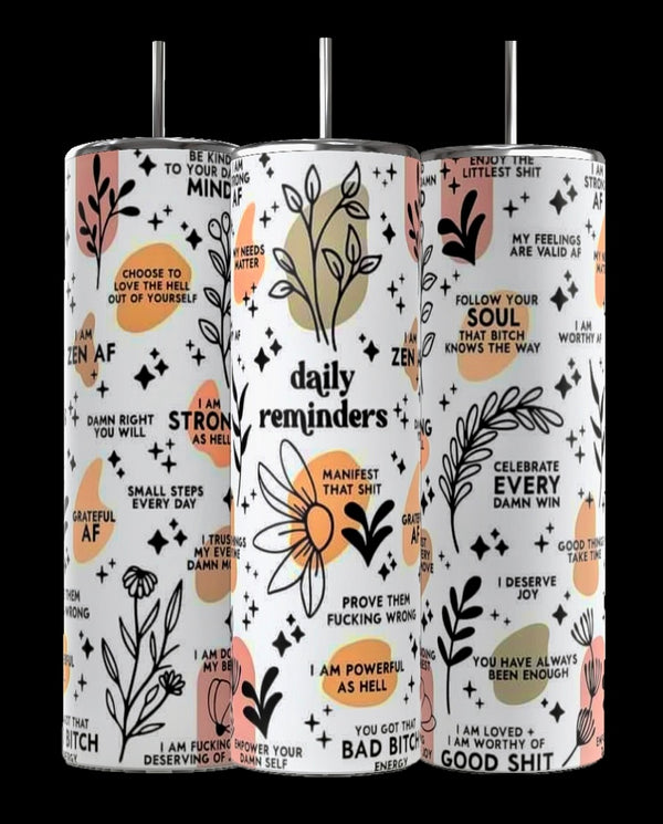 The Kreative Kreationz "Daily Reminders" 20oz Skinny Tumbler features three sublimated designs with motivational quotes and abstract florals. The white background with black, orange, and pink graphics presents positive affirmations, while double-wall insulation keeps drinks at the perfect temperature.