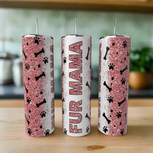 Three Kreative Kreationz Dog Mom 20oz Tumblers with white lids sit on a counter, featuring a pink glitter background, black dog bones and paw prints, and “FUR MAMA” vertically on the center customizable tumbler.