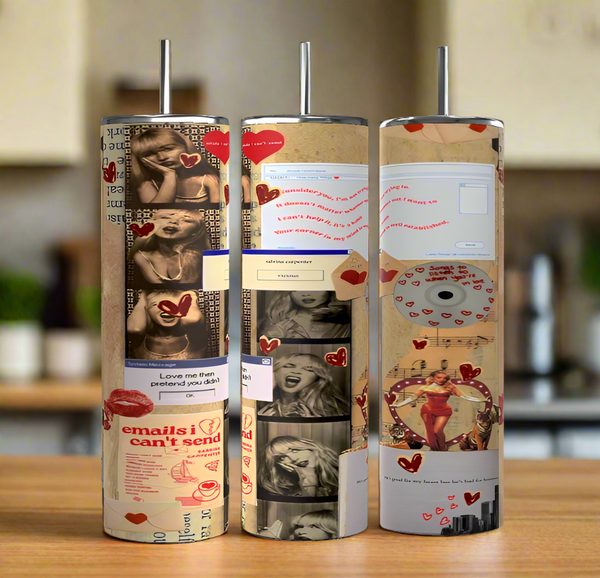 Three cylindrical Sabrina Carpenter Emails I Couldn't Send Tumblers by Kreative Kreationz, featuring handles, a luxury-inspired design with black-and-white photos, heart stickers, email text, and colorful emoticons. They stand on a wooden surface in a softly blurred kitchen setting.