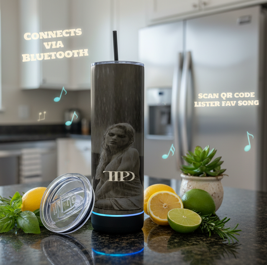 Tumbler with Bluetooth speaker on a kitchen counter with lemons and limes