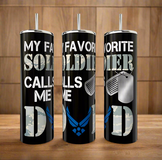 Three Kreative Kreationz Soldier Dad 20oz Tumblers with military themes—camo, Air Force blue, dog tags, and a customizable option—feature "My favorite soldier calls me dad," all showcased on a wooden surface.