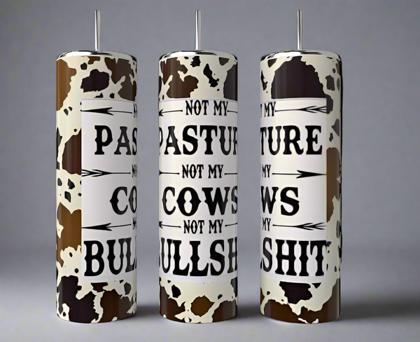 The Kreative Kreationz Not My Pasture 20oz Tumbler features a cow-print design, eco-friendly build, metal straw, and the bold black phrase “Not my pasture, not my cows, not my bullshit” on a white background.