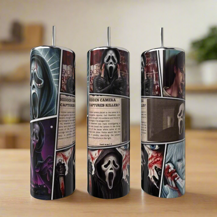 The Ghostface 20oz Tumbler by Kreative Kreationz showcases comic-style Scream art, dramatic scenes, and blood splatters—crafted as reusable drinkware, set against a wooden surface with a blurred background.