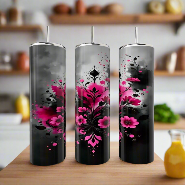 Three Kreative Kreationz Aesthetic Smokey Flowers 20oz stainless steel tumblers with lids and straws, featuring black and gray floral designs, sit on a kitchen counter with shelves softly blurred in the background.