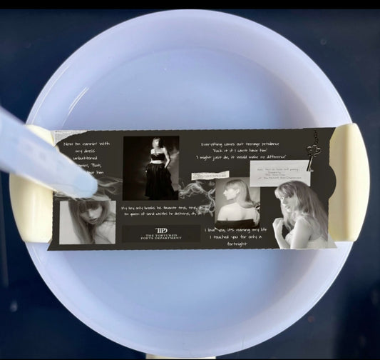 The TTPD Collage Stanley Lid Plate/Topper by Kreative Kreationz showcases a black-and-white photo of a woman in various poses with resilience text and "TID Project Presentation" at the bottom, held like a sublimated product and resembling a clock dial against a dark background.