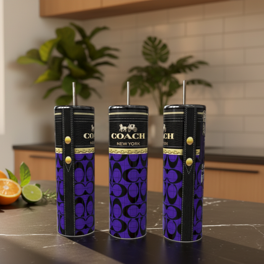 Three-patterned tumblers on a kitchen counter with plants in the background.