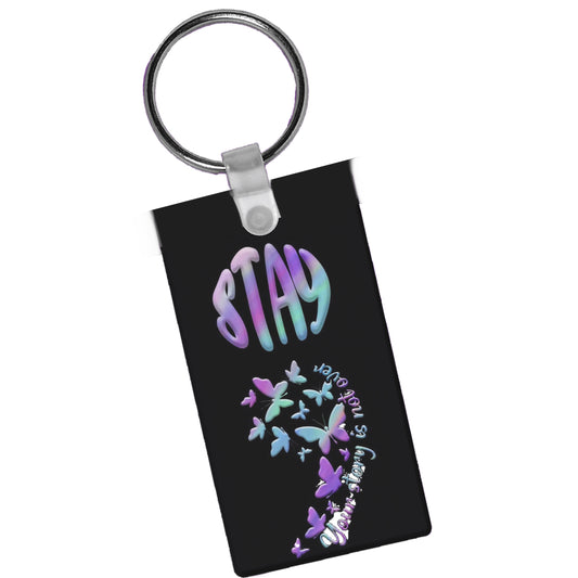 The Kreative Kreationz Suicide Awareness Gift Set features a black keychain with a semi-colon, “STAY” in bold pastel letters, butterflies forming the semicolon, and "Your story is not over”—a meaningful suicide awareness gift.