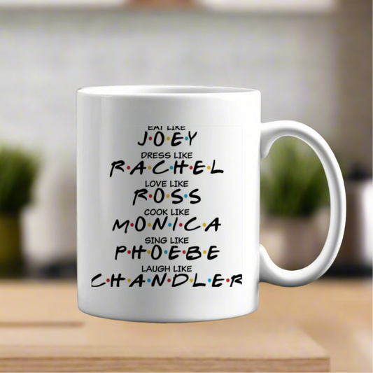 The Friends Mug by Kreative Kreationz features playful text: "Eat like Joey, Dress like Rachel, Love like Ross, Cook like Monica, Sing like Phoebe, Laugh like Chandler," with a blurred kitchen backdrop for added charm—a perfect homage to the iconic show's beloved characters.