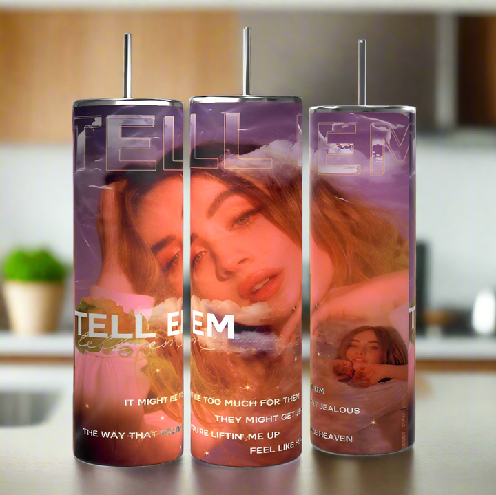 The Sabrina Carpenter Tell Em Tumblers by Kreative Kreationz feature a long-haired woman against a dreamy sky, with "TELL EM" in bold. Crafted from premium stainless steel, these eco-friendly tumblers showcase lyrics amid soft pink and purple hues.