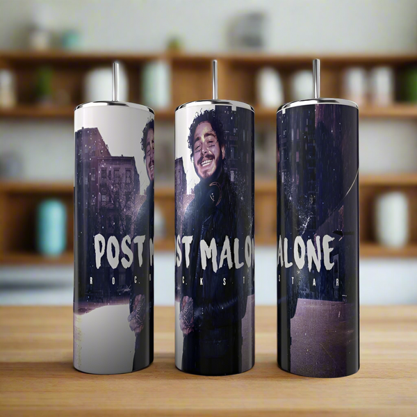 The Posty Tumbler by Kreative Kreationz showcases a "Post Malone Rockstar" design with a long-haired figure in a dark jacket against an urban backdrop. Made from high-quality stainless steel, these luxury-inspired tumblers elegantly rest on wood with blurred shelves and jars behind.