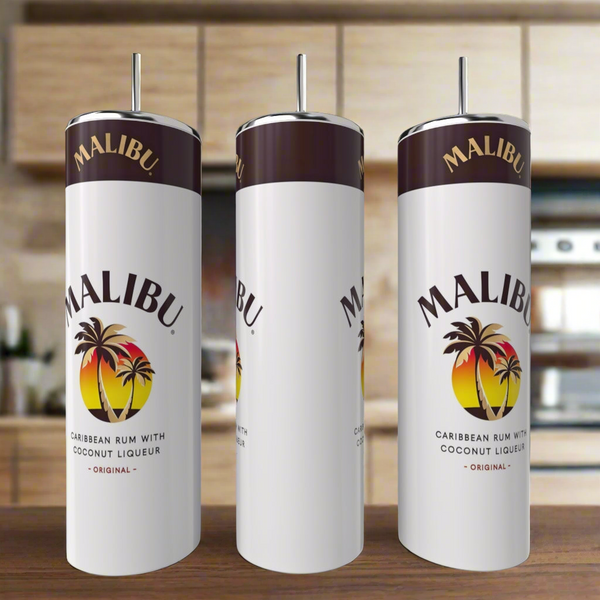 Three white Kreative Kreationz Malibu 20oz Tumblers with metal straws sit on a kitchen counter, each eco-friendly cup displaying the Malibu logo with palm trees and the text: "Caribbean Rum With Coconut Liqueur.