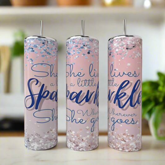 Three 20oz Kate Spade She Leaves Sparkle skinny tumblers by Kreative Kreationz, featuring pink design, silver lids and straws, blue and silver glitter accents, and the quote "She leaves a little sparkle wherever she goes.