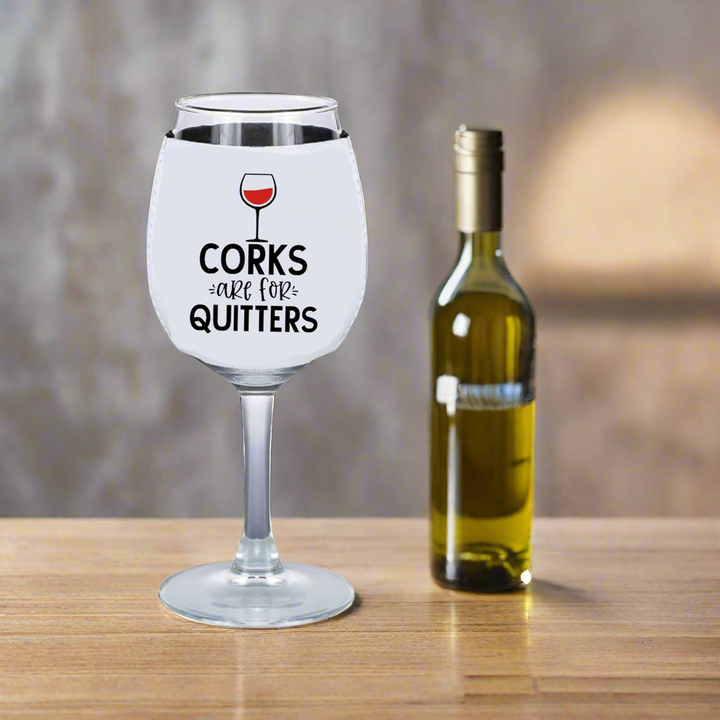 The Corks Are For Quitters - Wine Glass Koozie by Kreative Kreationz pairs perfectly with a large wine glass and bottle of white wine, making it an ideal accessory for any wine lover.