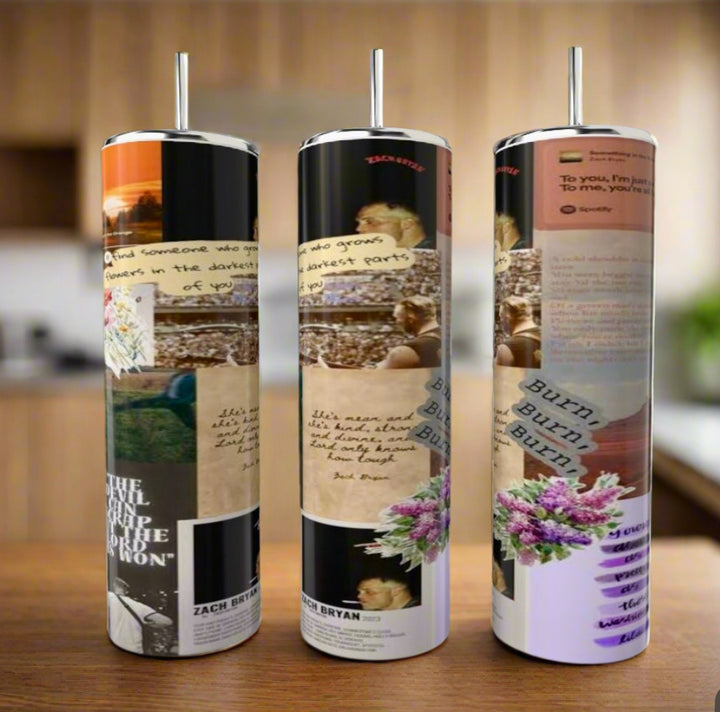 Three Zach Bryan Lyric Collage 20oz Tumblers by Kreative Kreationz, each reusable and stainless steel with a metal straw, display pastel text, flowers, and photos on a wooden surface against a blurred kitchen background.