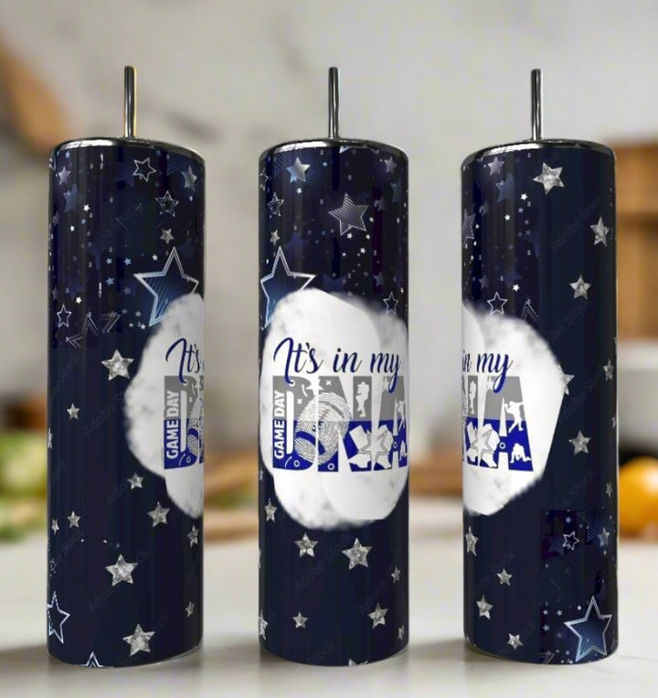 The Kreative Kreationz Game Day DNA 20oz Tumblers, in tall dark blue stainless steel with silver lids and straws, feature stars, sports icons, and “It’s in my DNA” and “Game Day”—a perfect reusable gift for any sports fan.