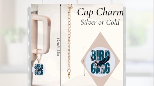 Kreative Kreationz’s Bird Gang | Eagles | Football Charm Dangle features a gold cup charm with an Eagles "BIRD GANG" pendant on a lobster clasp chain. Available in silver or gold. Measures 12 cm (4.72 in).