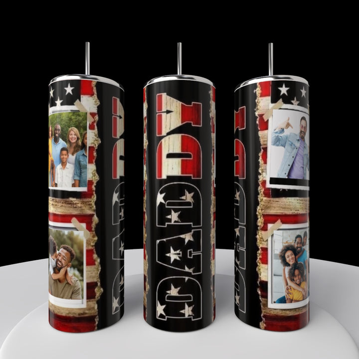 The Daddy Photo 20oz Tumbler by Kreative Kreationz features a bold "DAD" design, decorated with small family photos and stars in patriotic red, white, and blue on a sleek stainless steel background.