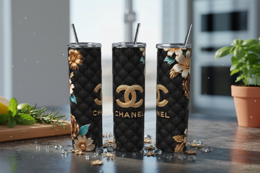 Three-themed tumblers with floral designs on a reflective surface.