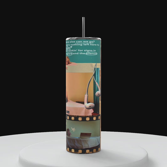 Sabrina carpenter tumbler with black background on a white platform rotating in a circle motion counter clockwise showing 360 angle of the wrapped tumbler design